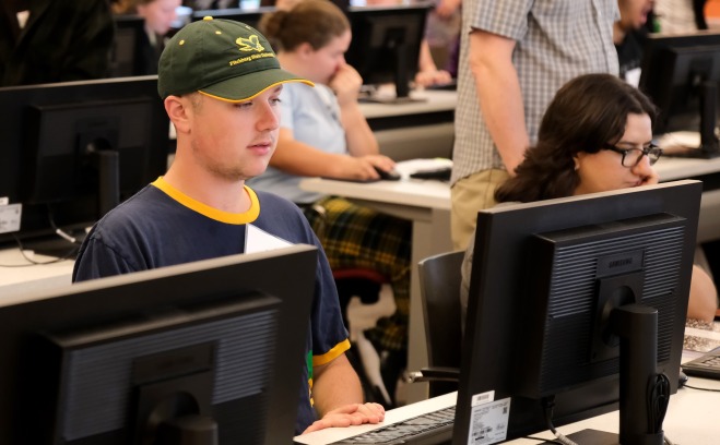 Students on computers at tables