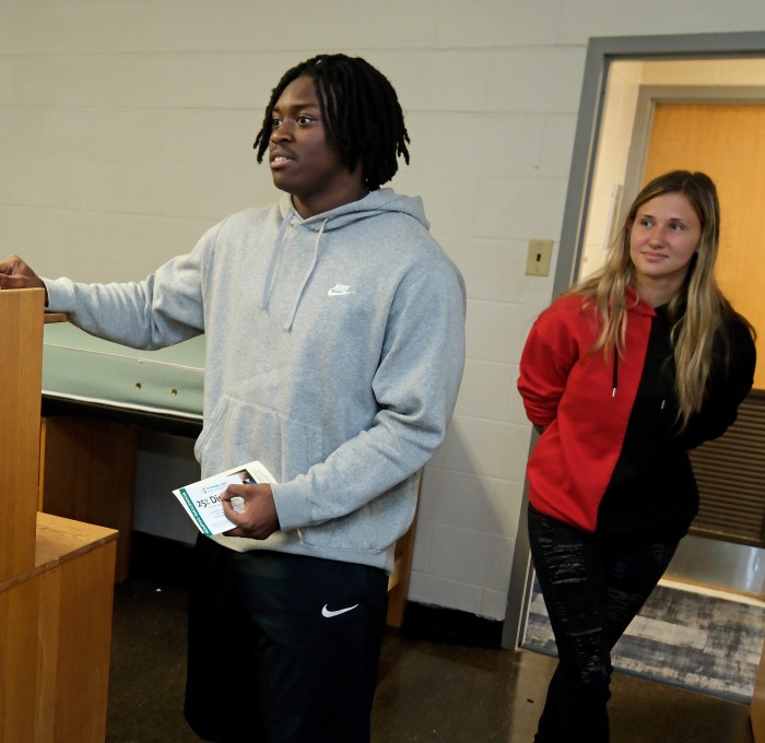 Male and female students checking out dorm room on first look Friday.