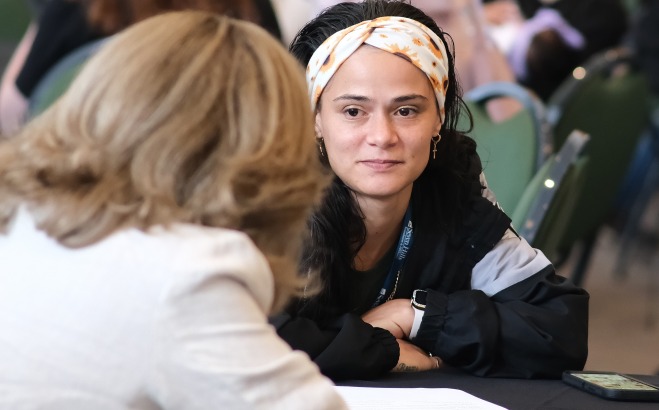 Student and advisor at table in main lounge