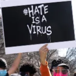 Hate is a virus protest poster