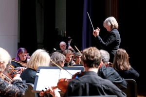 musicians and conductor on stage during music mega mix at Weston