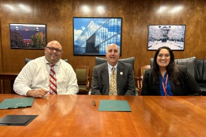 FPS Superintendent Jon Thompson, President Lapidus and FPS Assistant Superintendent Colon smile at Honors Compact signing