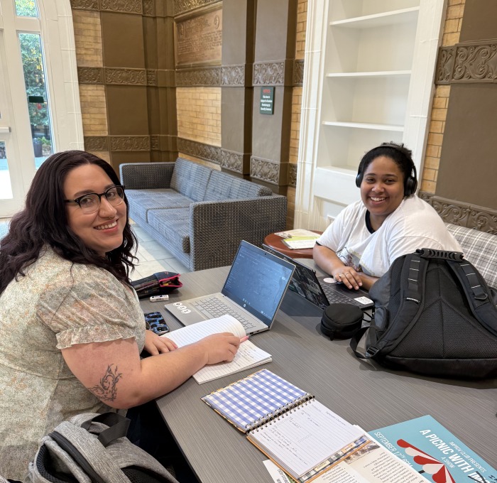 Female students at table in Thompson