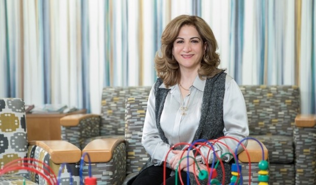 Mojdeh Bayat, Dean of Education in room with toys