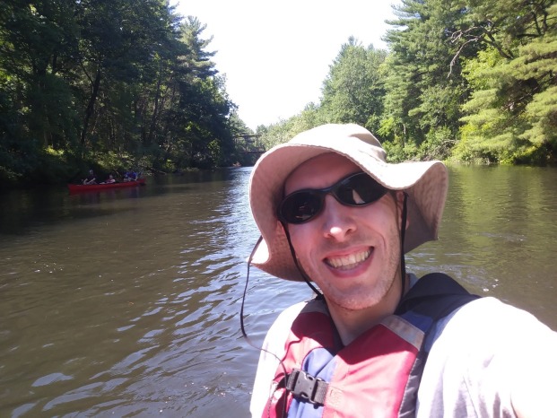 Dr. Daniel Welsh in a boat on a river