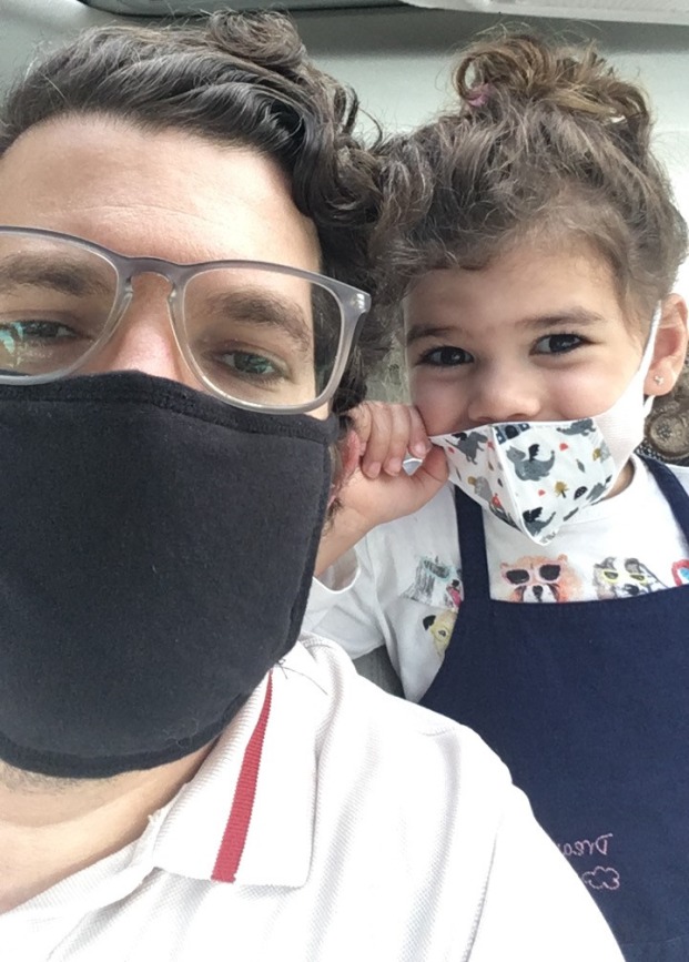 Samuel Tobin and his daughter wearing masks