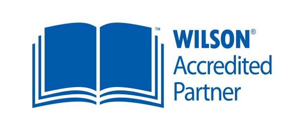 Blue open book and Wilson Accredited Partner words to right of it
