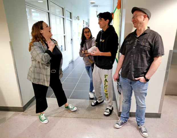 President Hodge speaks with student and family at First Look Friday