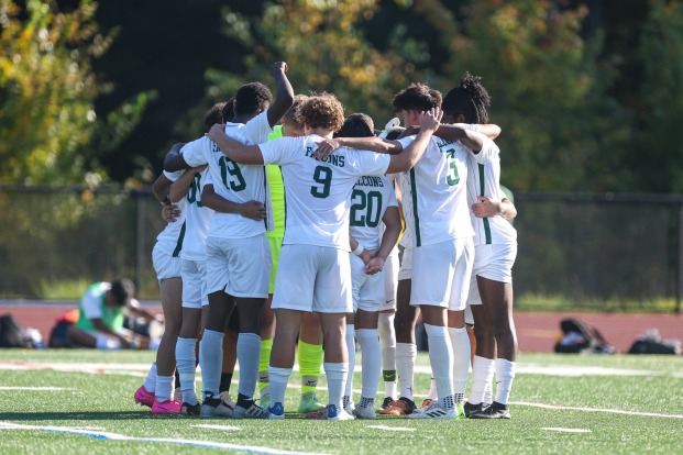 Men's soccer players at Elliot Field