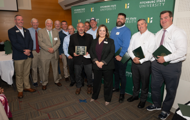 Members of the 1993-94 Men's Ice Hockey team at Hall of Fame induction