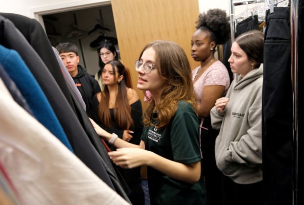 Students looking through the clothes in the professional clothing closet in Hammond