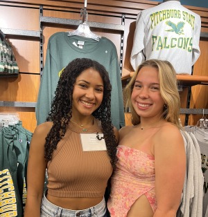Students in front of Fitchburg State gear in bookstore