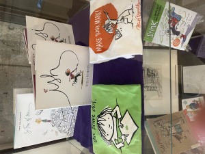 Various books, t-shirts, and other memorabilia of the Peter Reynolds Exhibit 